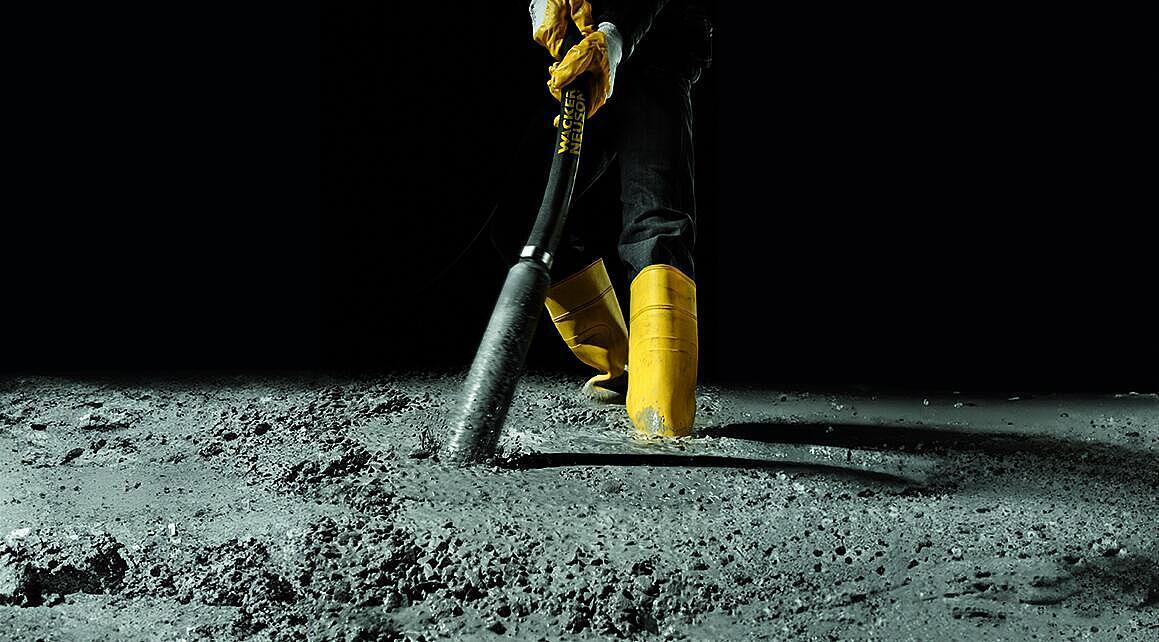 concrete consolidation with an internal vibrator in action