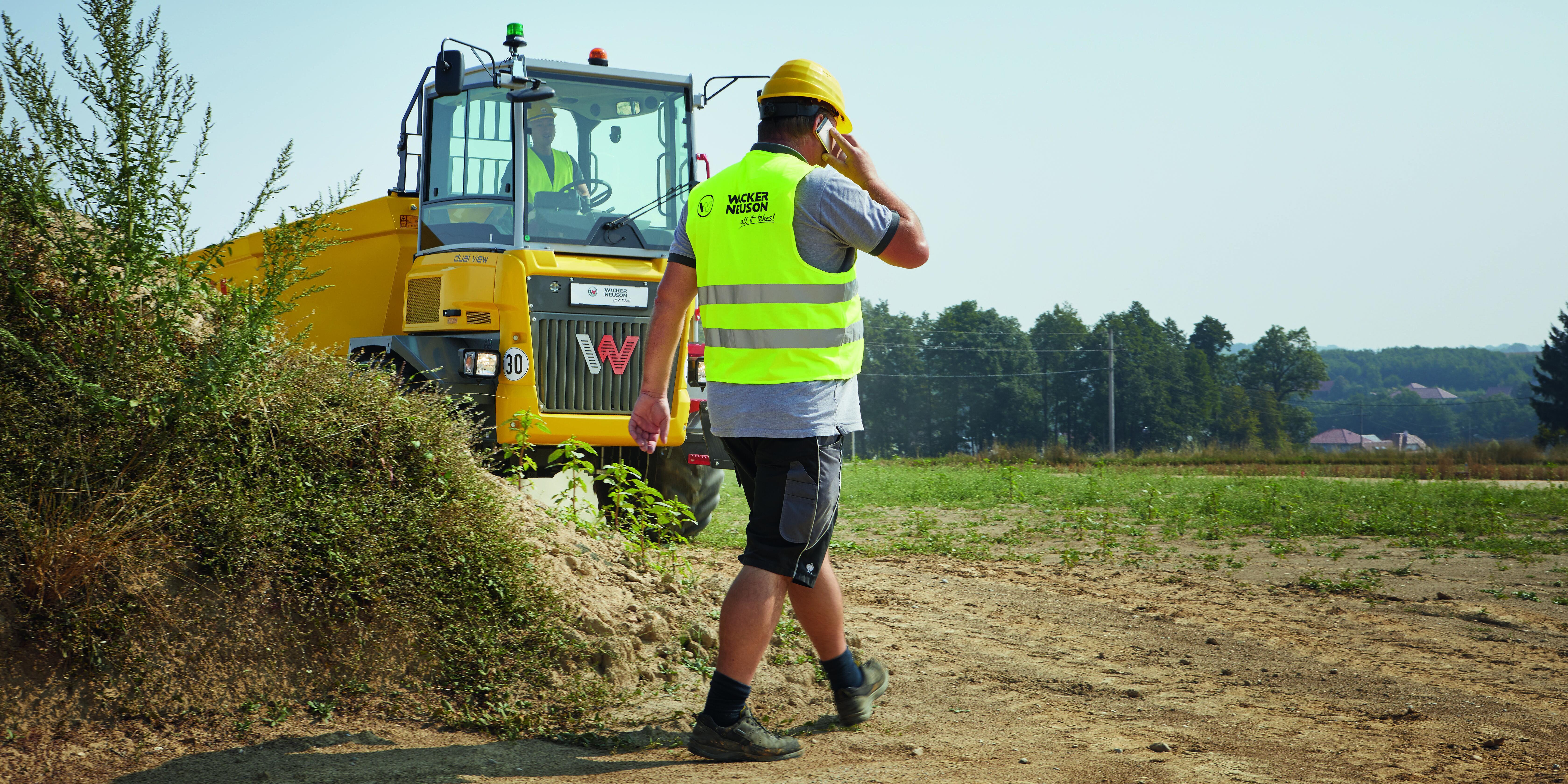 man walking in front of dumper. presentation of Object detection for dumpers